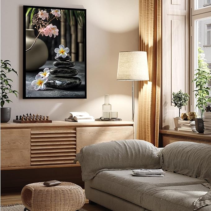 A harmonious black stone stack paired with white and pink flowers bamboo and ceramic vases creates a tranquil Zen decor for minimalist homes and mindful spaces 24x36in Metal blackFramed