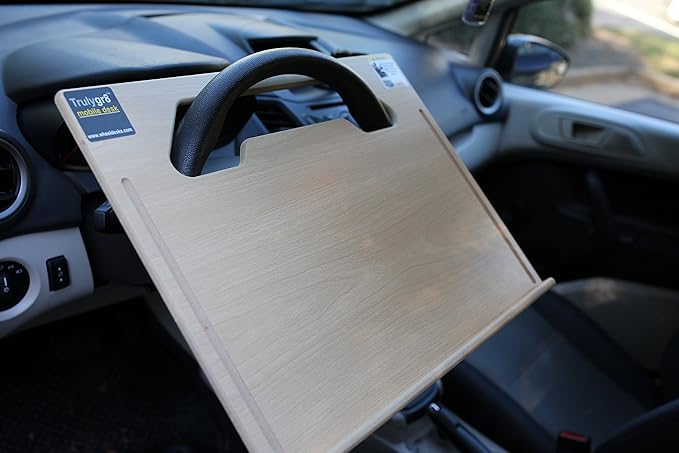The Executive steering wheel desk measures 17” 3/4” × 13 7/8” provides a stable surface for most laptops, tablets, phones, and paperwork.